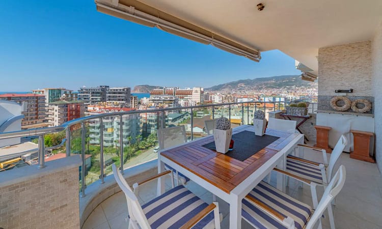 down-floor balcony with table and chairs